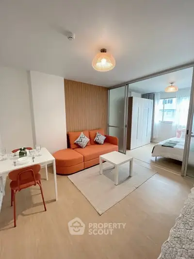 Modern studio apartment with cozy living area and stylish decor