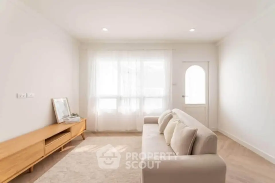 Bright and airy living room with modern minimalist decor and natural light.