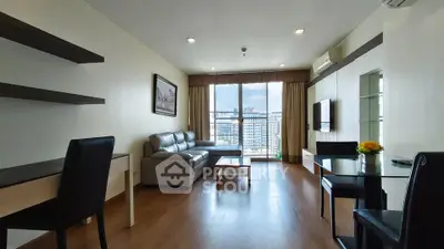 Spacious modern living room with city view, elegant furniture, and natural light.
