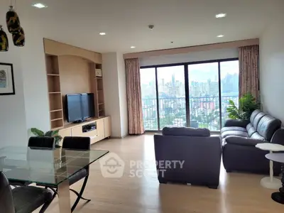 Spacious living room with stunning city view and modern furnishings
