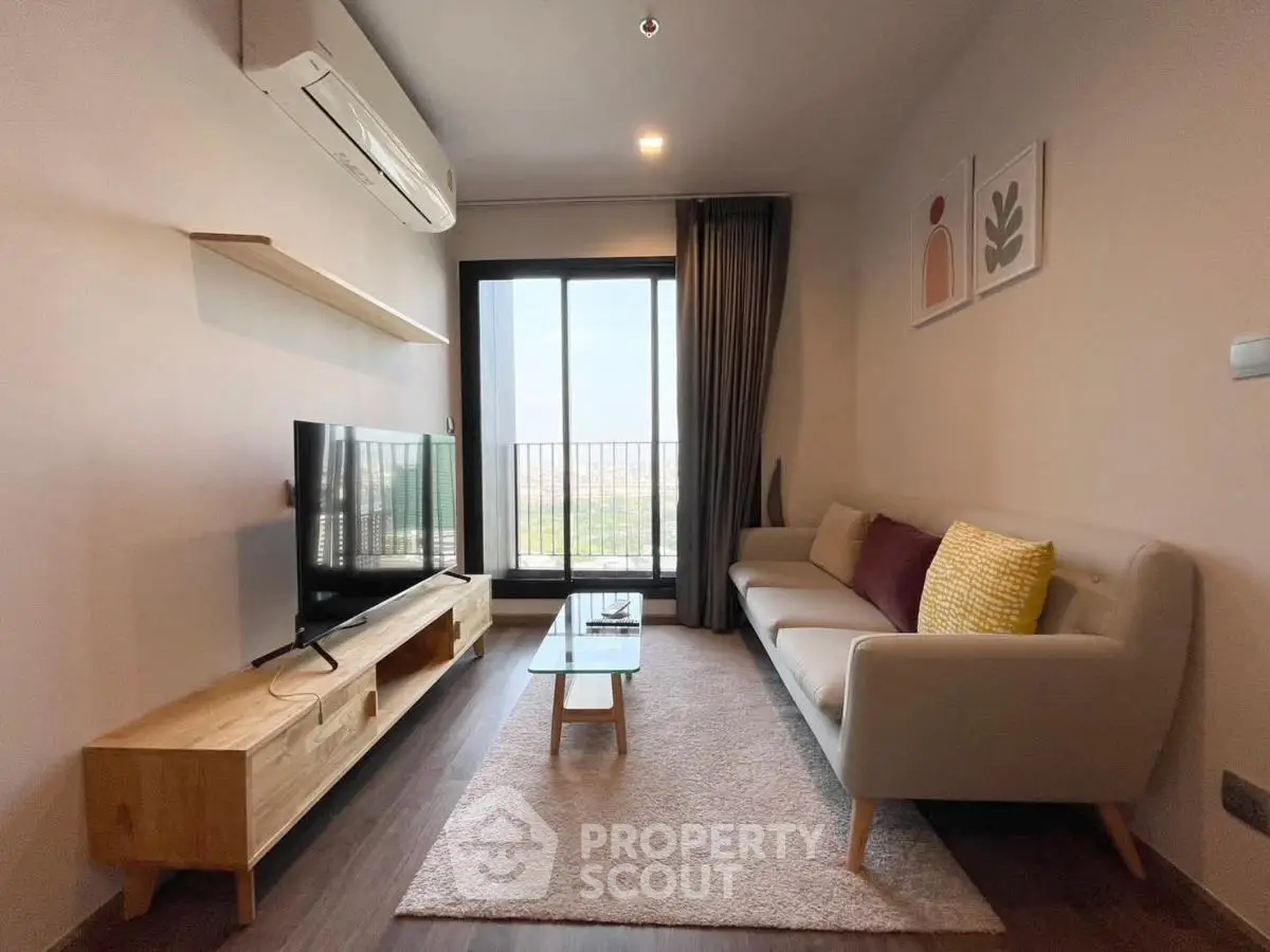 Modern living room with stylish decor and balcony view