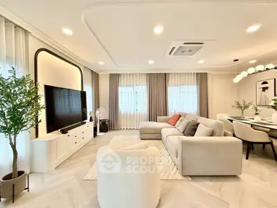 Spacious modern living room with elegant decor and large windows