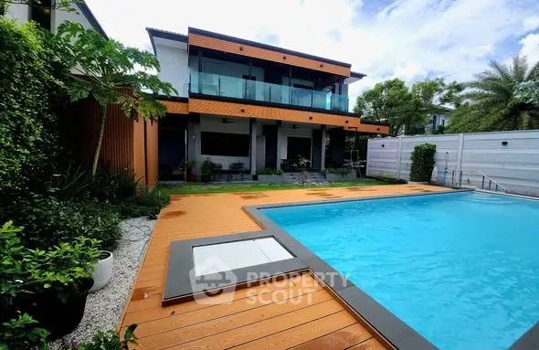 Luxurious modern home with private pool and lush garden, perfect for relaxation and entertainment.