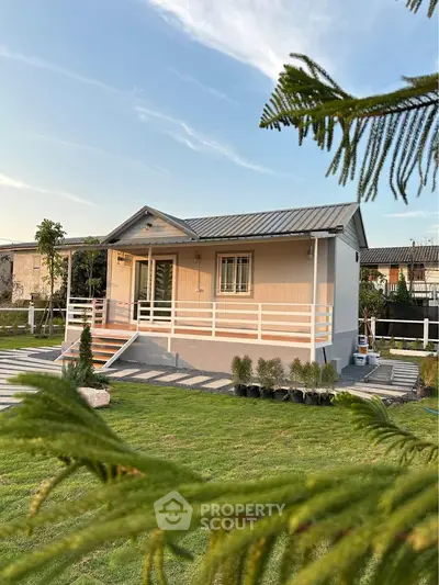 Charming small house with lush green lawn and modern design