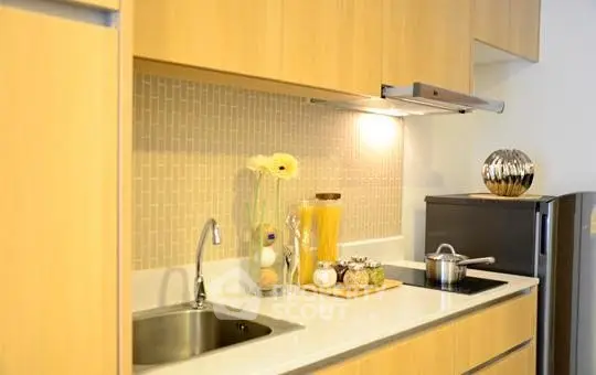 Modern kitchen with sleek cabinets and stainless steel appliances