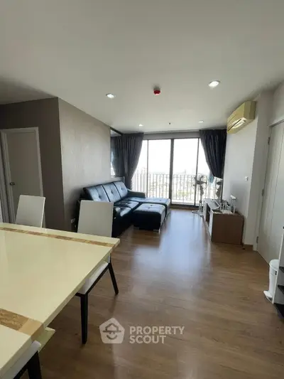 Modern living room with large windows and stylish furniture