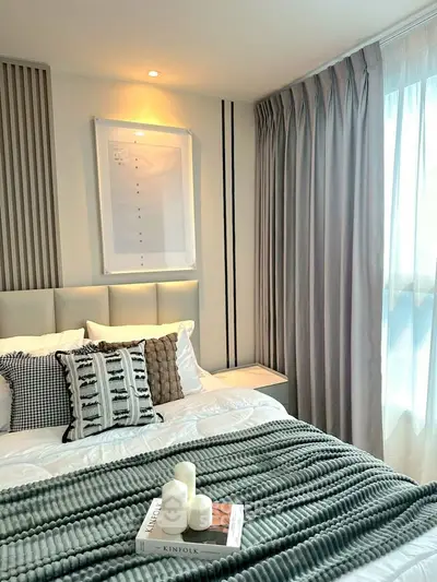 Elegant bedroom with cozy decor and natural light