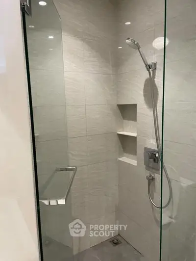 Modern bathroom with sleek glass shower and elegant tile design
