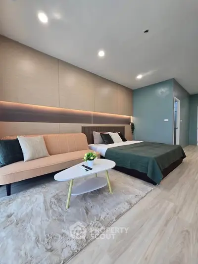Modern bedroom with stylish decor and cozy seating area