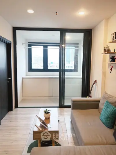 Modern living room with cozy sofa and large window view