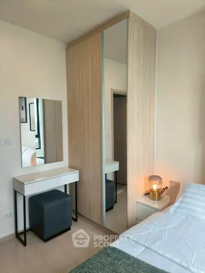 Modern bedroom with stylish wardrobe and cozy lighting