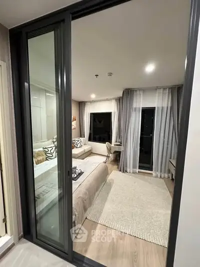 Modern bedroom with sliding glass doors and elegant decor