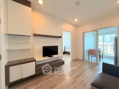 Modern living room with sleek design and city view balcony