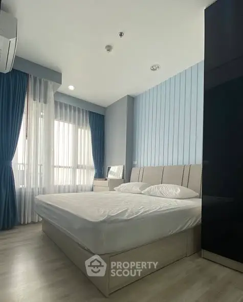 Modern bedroom with stylish decor and natural light