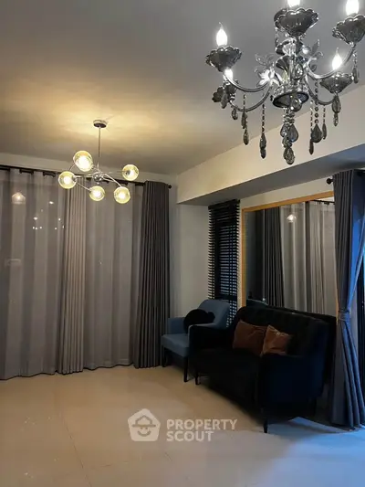 Elegant living room with modern chandeliers and stylish seating