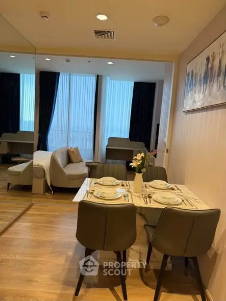 Stylish modern living room with dining area and cozy seating, perfect for urban living.