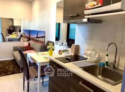 Charming modern kitchen with open layout and cozy dining area, perfect for small apartments.