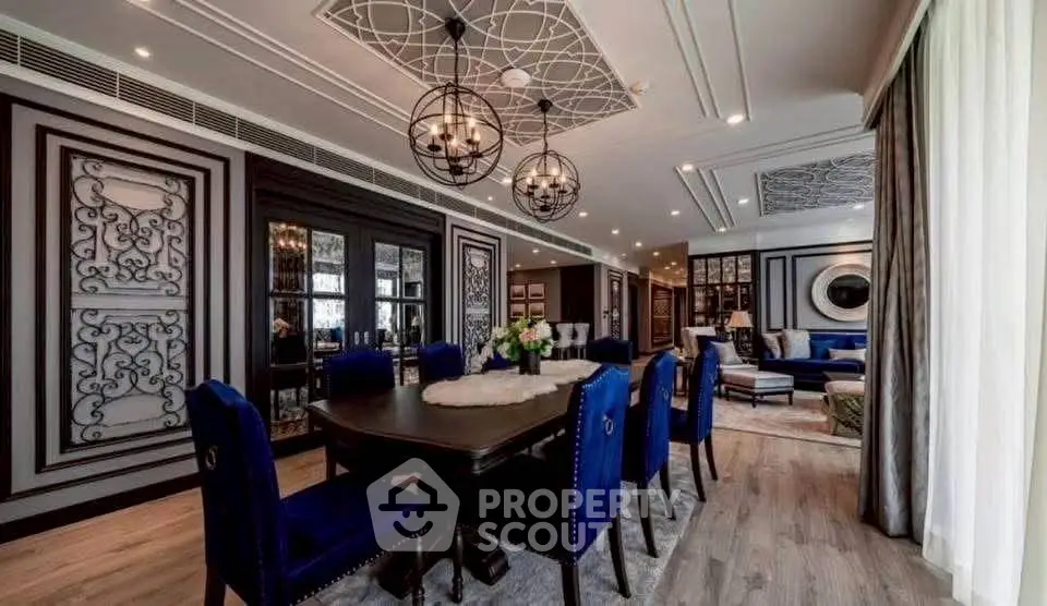 Luxurious dining and living area with elegant decor and plush seating