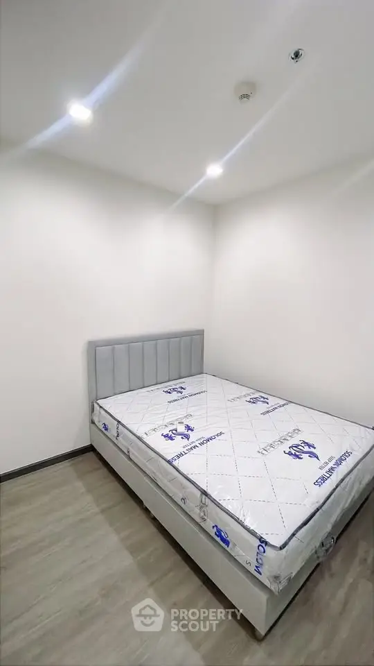 Modern bedroom with new mattress and minimalist design, perfect for a cozy living space.