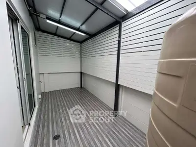 Modern covered balcony with sleek design and water tank