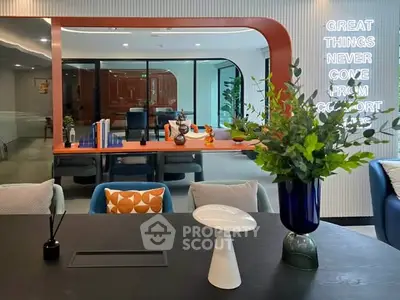 Modern living room with stylish decor and motivational neon sign