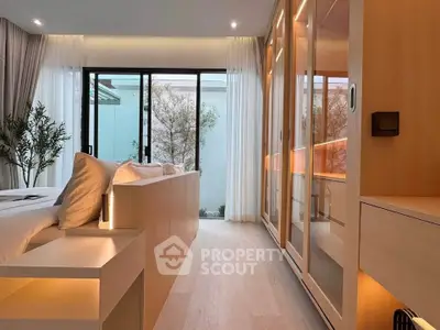 Luxurious bedroom with floor-to-ceiling windows and elegant lighting