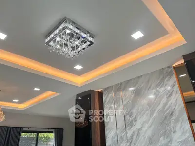 Luxurious modern living room with elegant ceiling design and chandelier