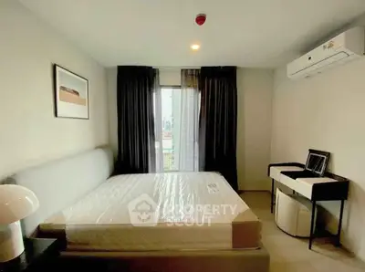 Modern bedroom with large window and air conditioning in a stylish apartment.