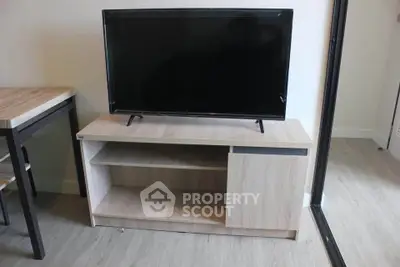 Modern living room with sleek TV stand and flat-screen television