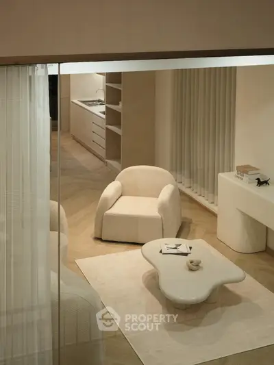 Elegant modern living room with minimalist furniture and open kitchen layout