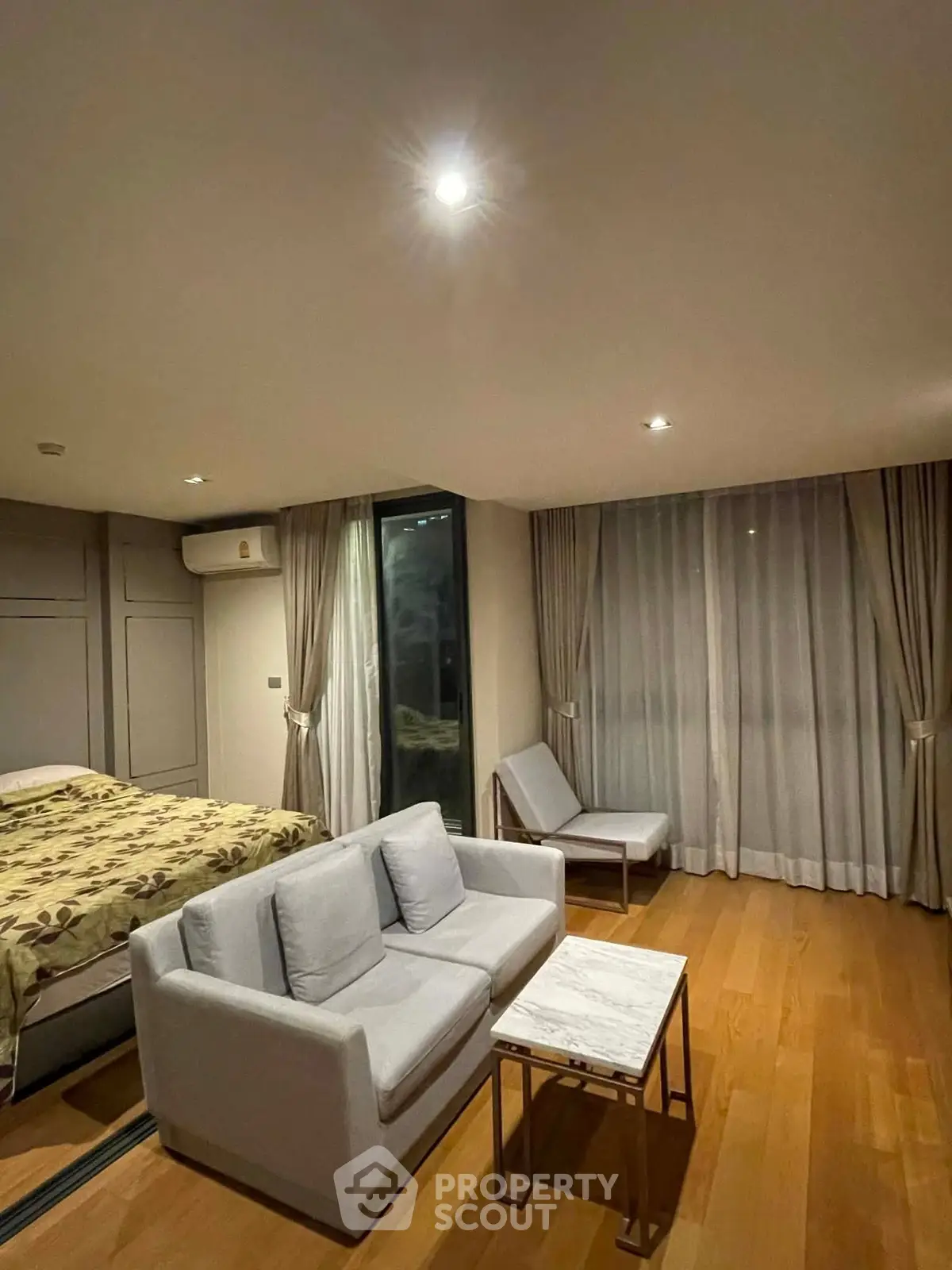 Modern studio apartment with cozy living area and stylish decor