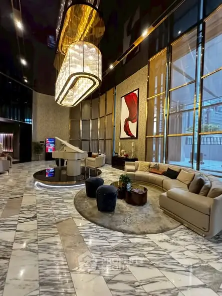 Luxurious modern living room with marble floors and elegant chandelier