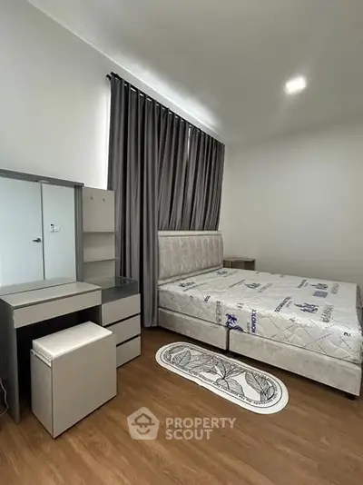 Modern bedroom with stylish furniture and natural light