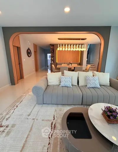Luxurious modern living room with elegant sofa and stylish dining area