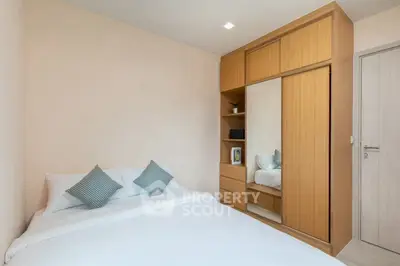 Cozy bedroom with built-in wardrobe and modern decor