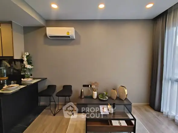 Modern living room with stylish decor and open kitchen layout