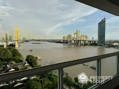 Stunning river view from high-rise balcony with cityscape and bridge