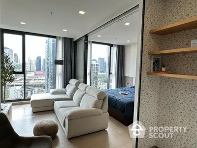 Modern condo living room with city view and cozy bedroom