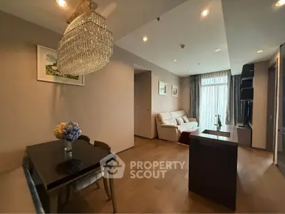 Elegant living room with chandelier and modern decor in a cozy apartment