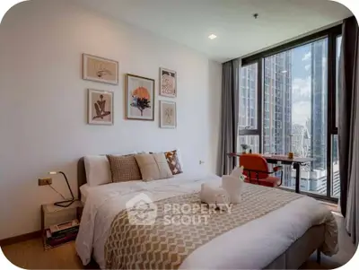 Modern bedroom with large windows and city view, featuring stylish decor and cozy ambiance.