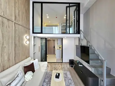 Modern loft apartment with stylish living room and mezzanine, featuring sleek design and open layout.