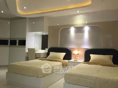 Luxurious modern bedroom with twin beds and ambient lighting