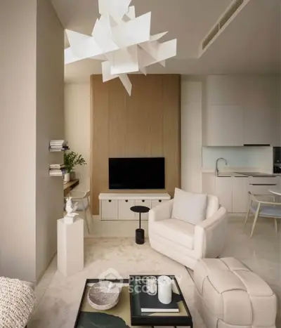 Modern living room with stylish furniture and open kitchen layout, featuring a unique ceiling light fixture.