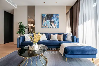 Luxurious living room with elegant blue sofa and modern decor