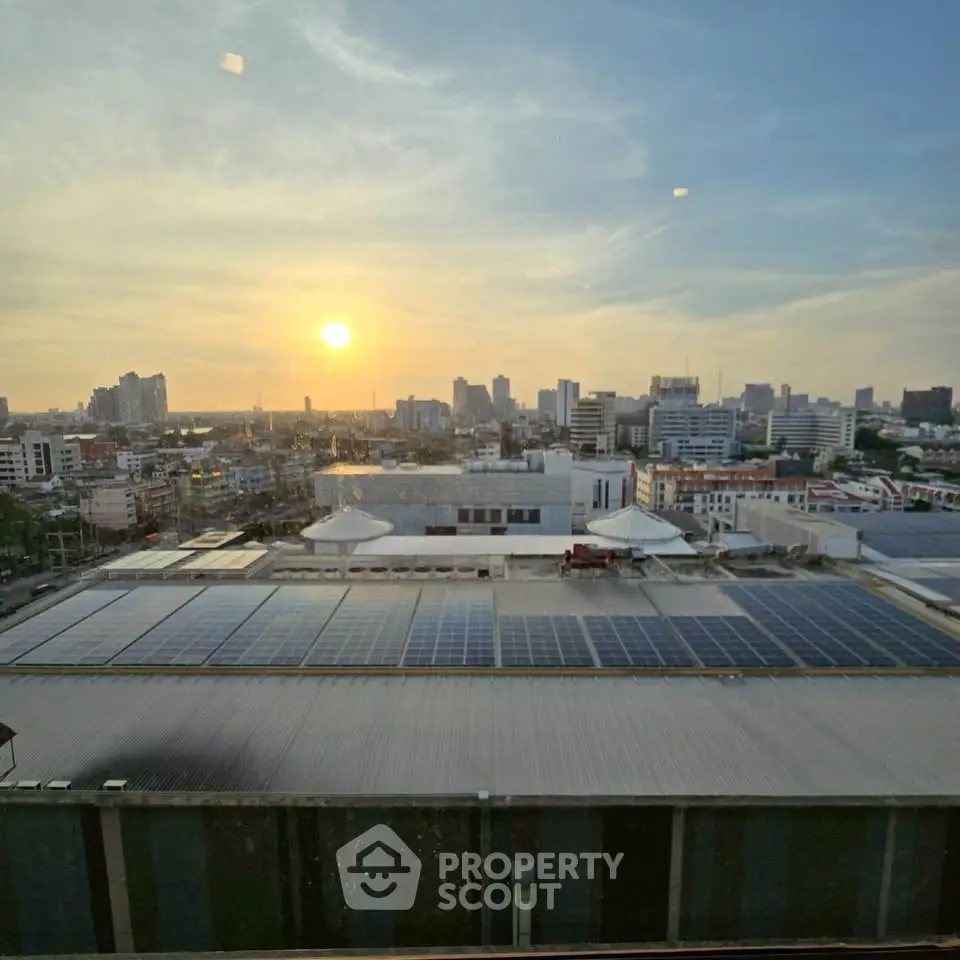Stunning cityscape view with solar panels at sunset, perfect for eco-friendly urban living.