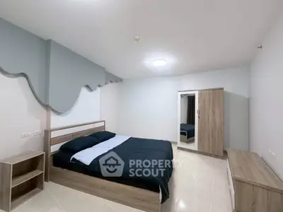 Modern minimalist bedroom with stylish decor and wooden furniture