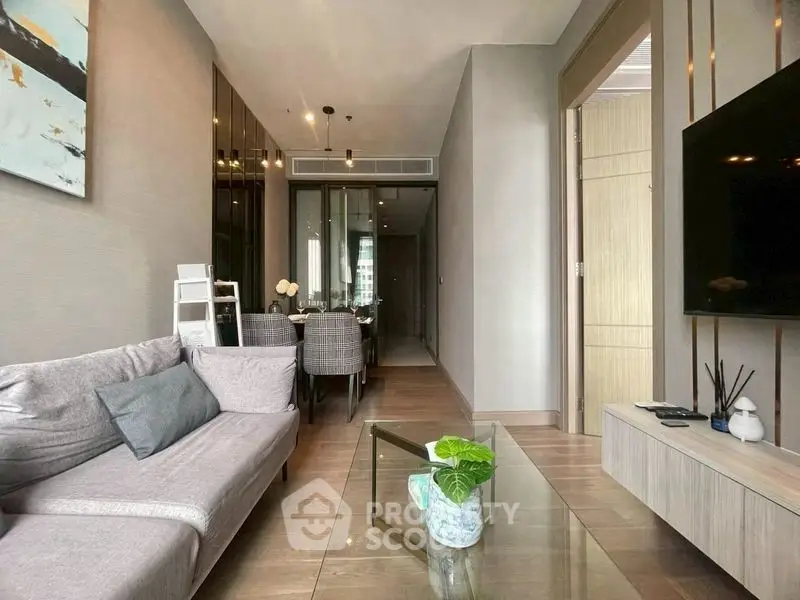 Modern living room with sleek furniture and elegant decor in a stylish apartment.