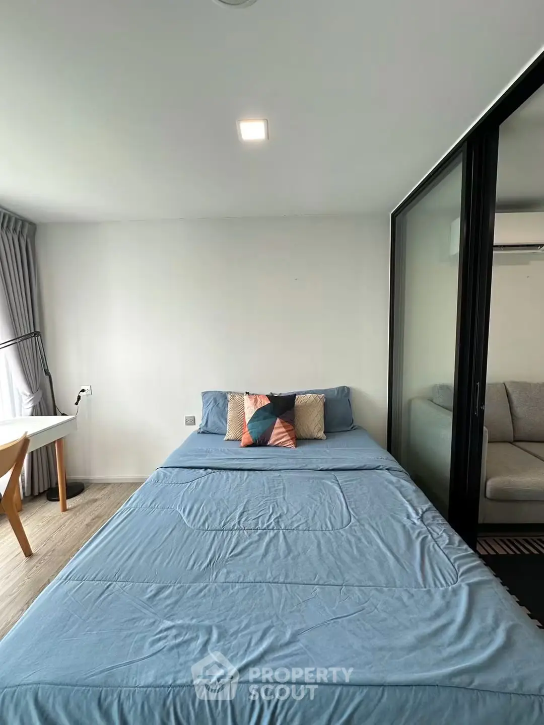 Modern bedroom with cozy bed and stylish decor in a bright apartment