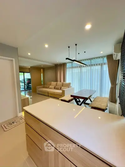 Spacious modern living room with elegant decor and natural light