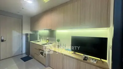 Modern kitchen with sleek cabinetry and integrated appliances in stylish apartment.